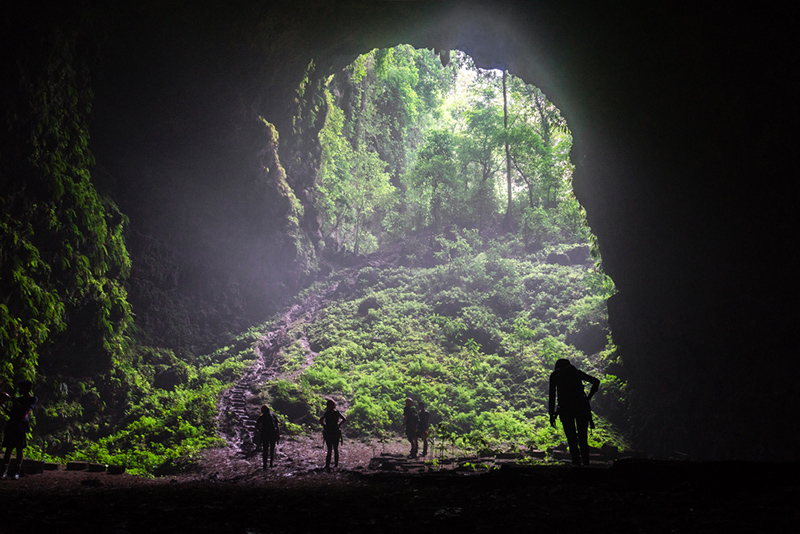 Adventurers exploring a cave